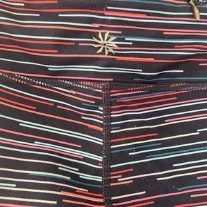 Athleta tights with stash pockets, navy with horizontal stripes, size M